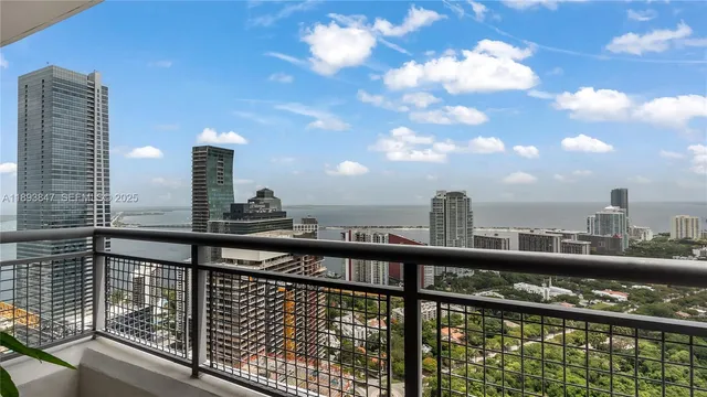 a view of balcony with wooden floor