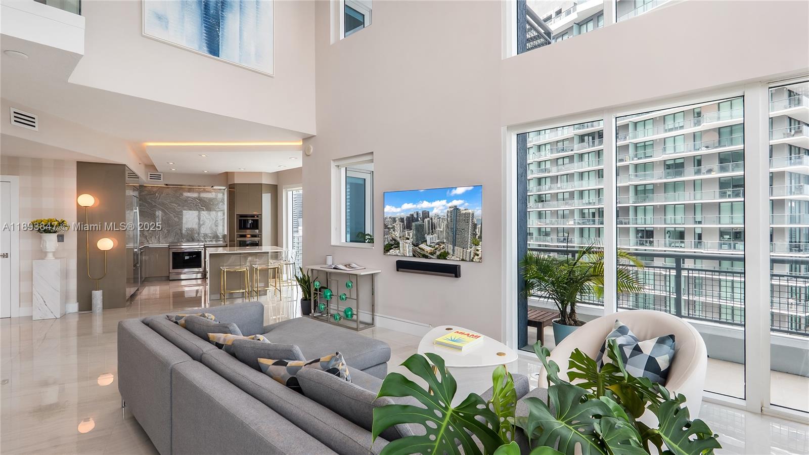 60 Southwest 13th Street, Unit 4200 Miami, FL 33130 - Photo 43 of 52 a living room with furniture and a potted plant