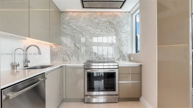 a kitchen with a stove and a sink