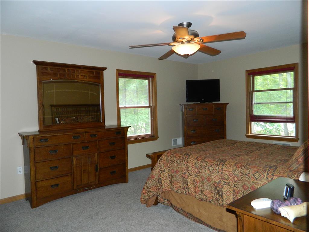 328 Pin Oak Road Stroudsburg, PA 18360 - Photo 21 of 37 Plush carpet and treetop views create a serene retreat in this cozy bedroom.