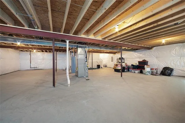 a view of empty room with wooden ceiling