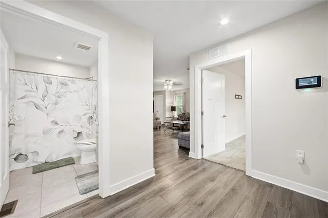 wooden floor with white walls