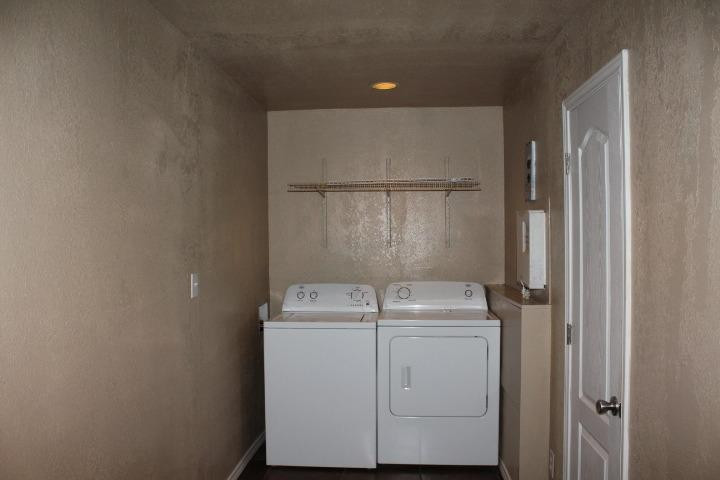 3111 30th Street Lubbock, TX 79410 - Photo 15 of 22 a utility room with dryer and washer