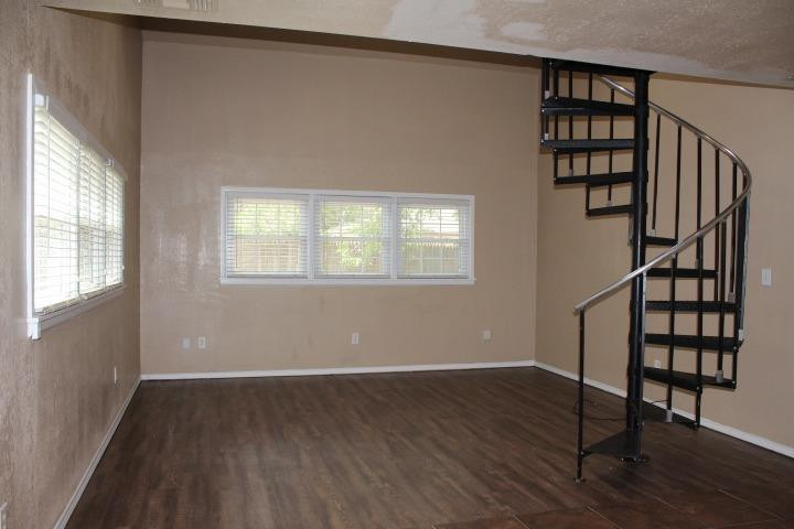 3111 30th Street Lubbock, TX 79410 - Photo 16 of 22 a view of entryway with wooden floor and stairs