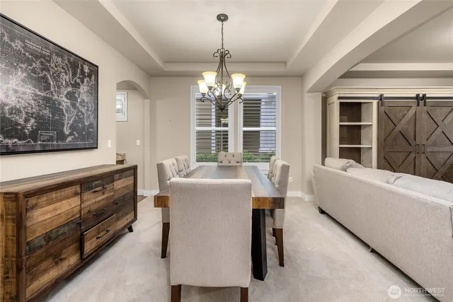 a bathroom with a tub sink and large window