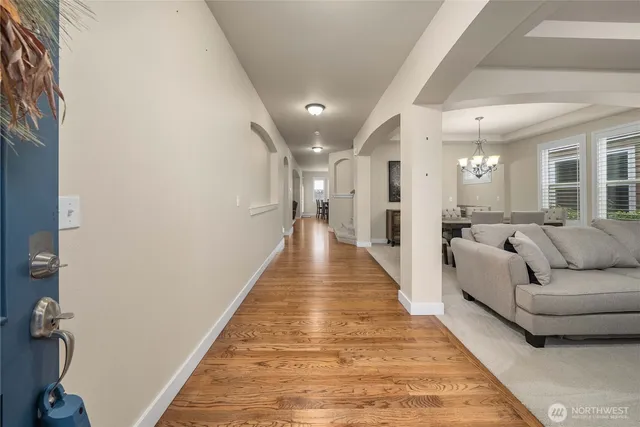 a hallway with a couch and a view of a hallway