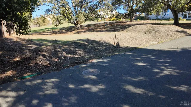 a view of snow on the side of a road