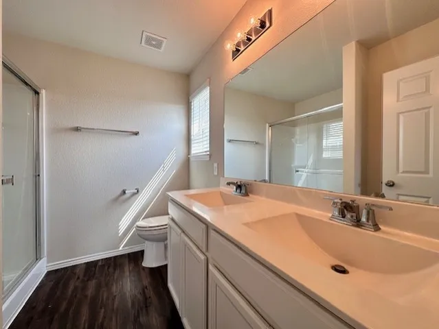 a bathroom with a sink and a large mirror