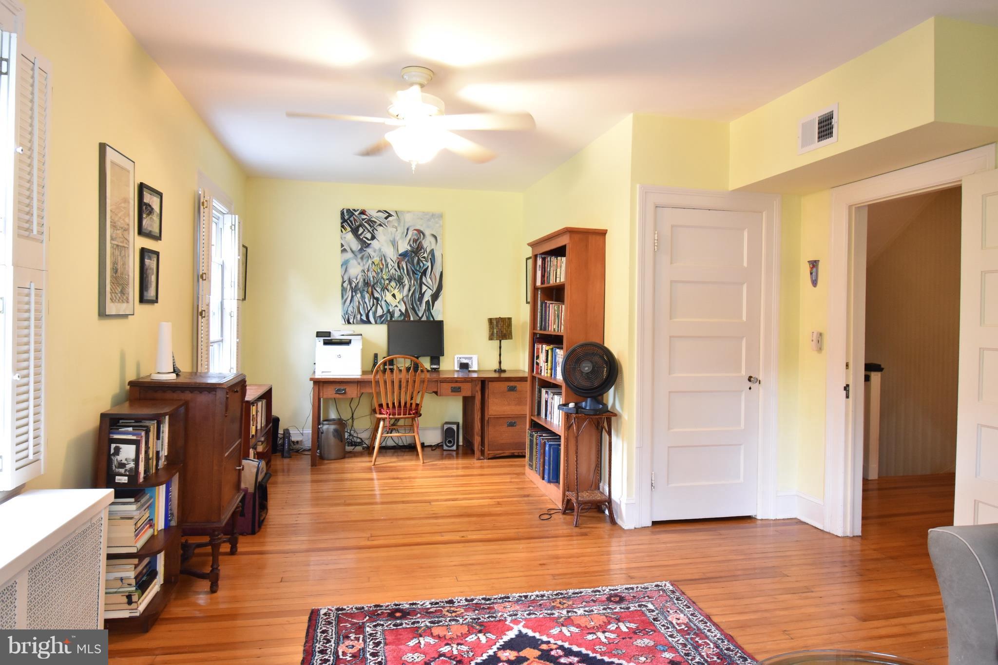 3906 Cloverhill Road Baltimore, MD 21218 - Photo 22 of 30 a living room with furniture and a wooden floor