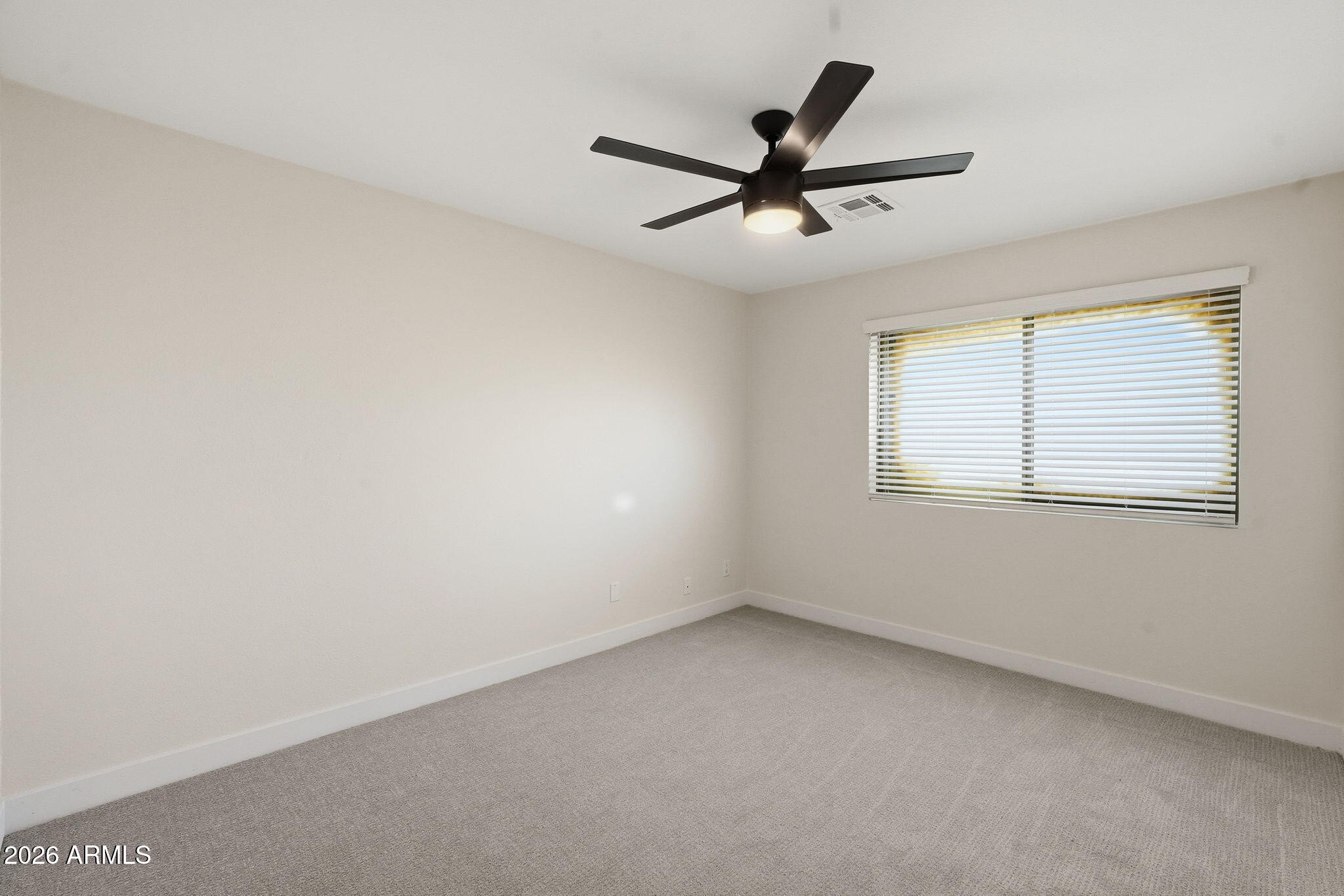 1663 West Monte Avenue Mesa, AZ 85202 - Photo 15 of 21 a view of a big room with wooden floor and windows