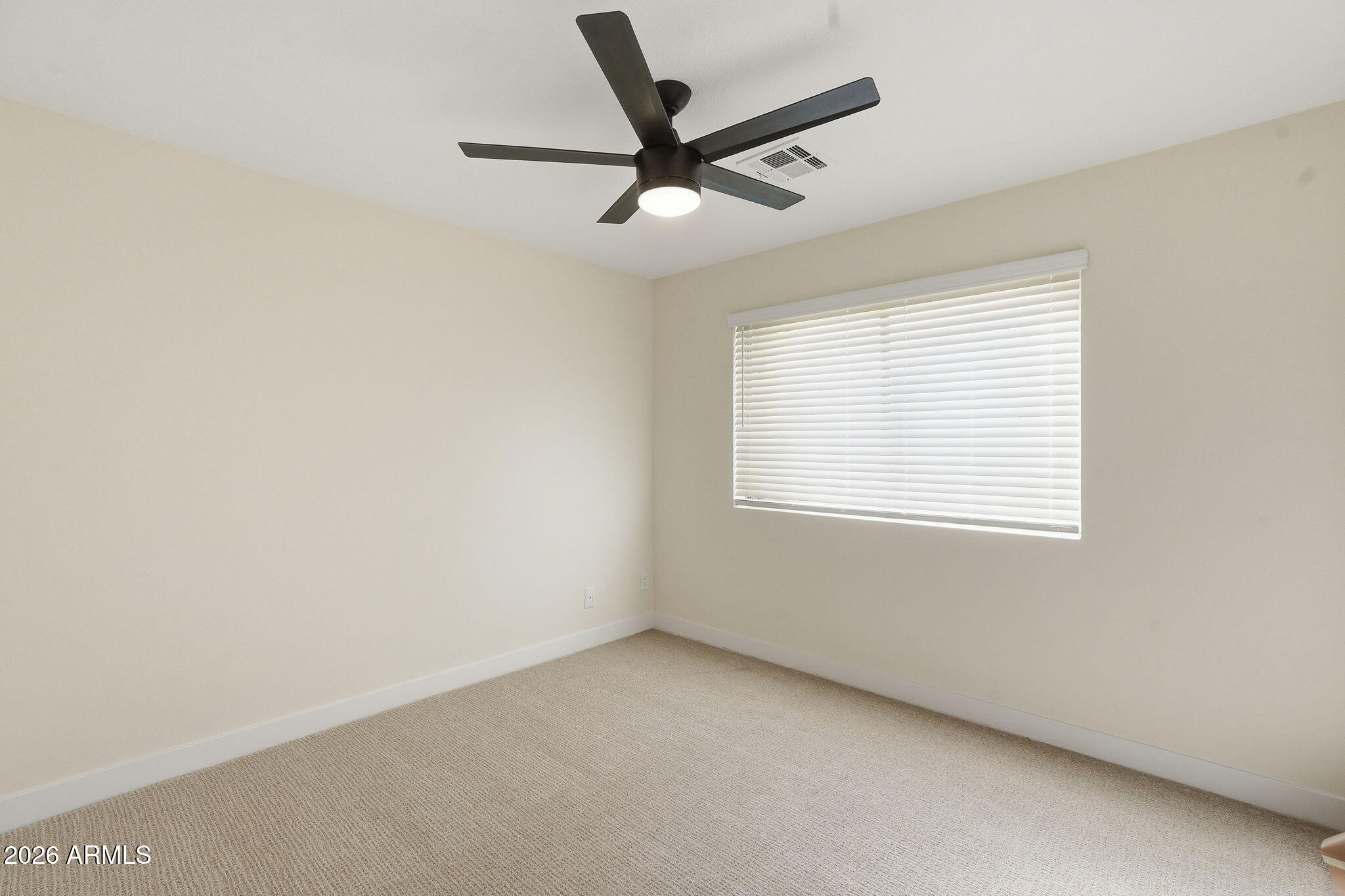 1663 West Monte Avenue Mesa, AZ 85202 - Photo 16 of 21 an empty room with a window