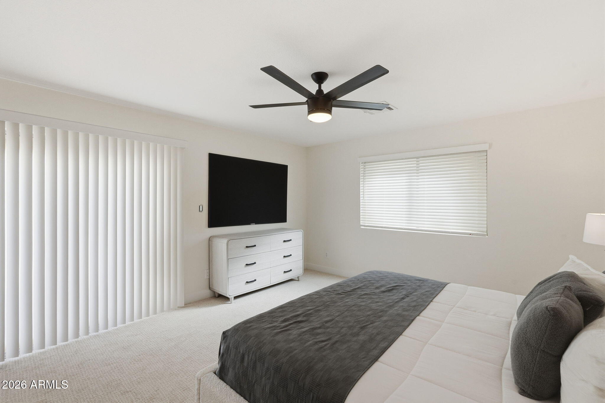 1663 West Monte Avenue Mesa, AZ 85202 - Photo 17 of 21 a bedroom with a bed and a flat screen tv