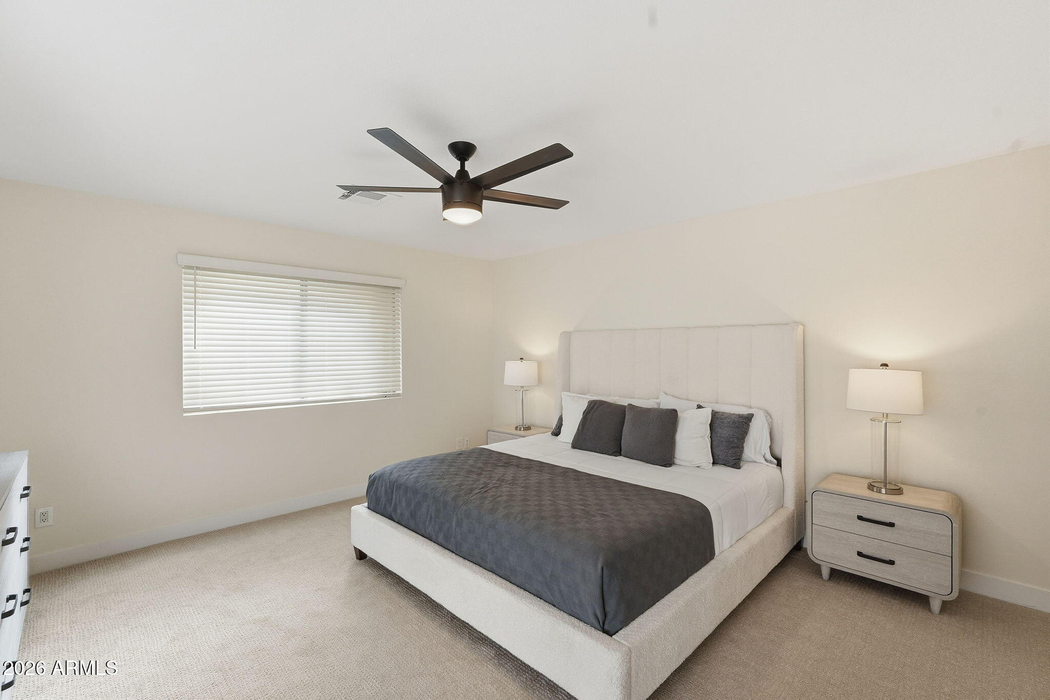 1663 West Monte Avenue Mesa, AZ 85202 - Photo 18 of 21 a bedroom with a bed and a chandelier