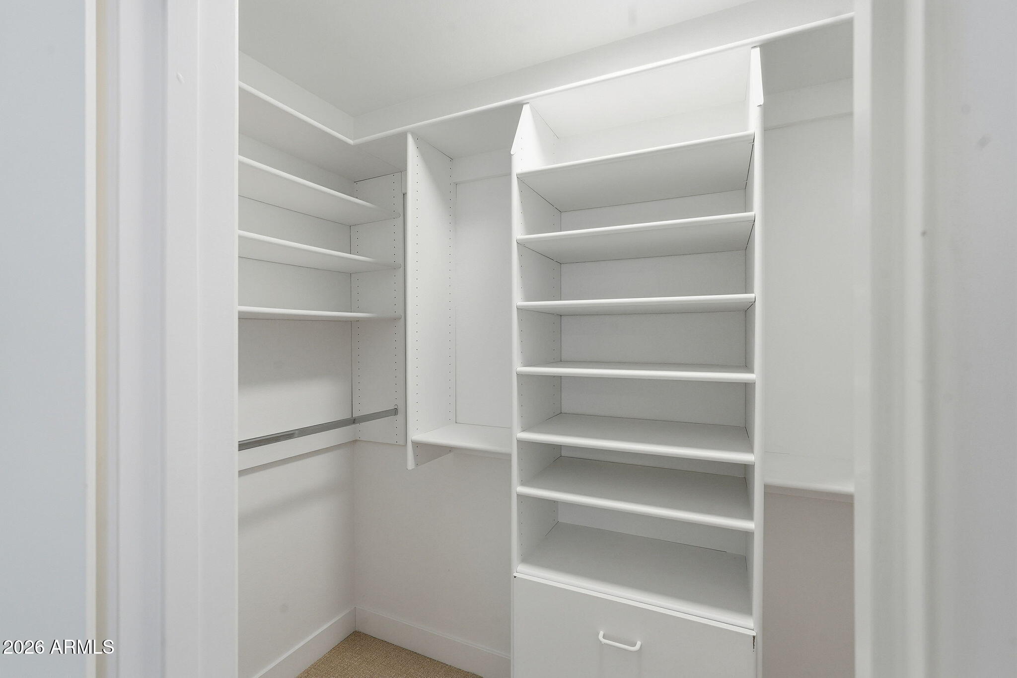 1663 West Monte Avenue Mesa, AZ 85202 - Photo 19 of 21 a view of walk in closet with empty racks