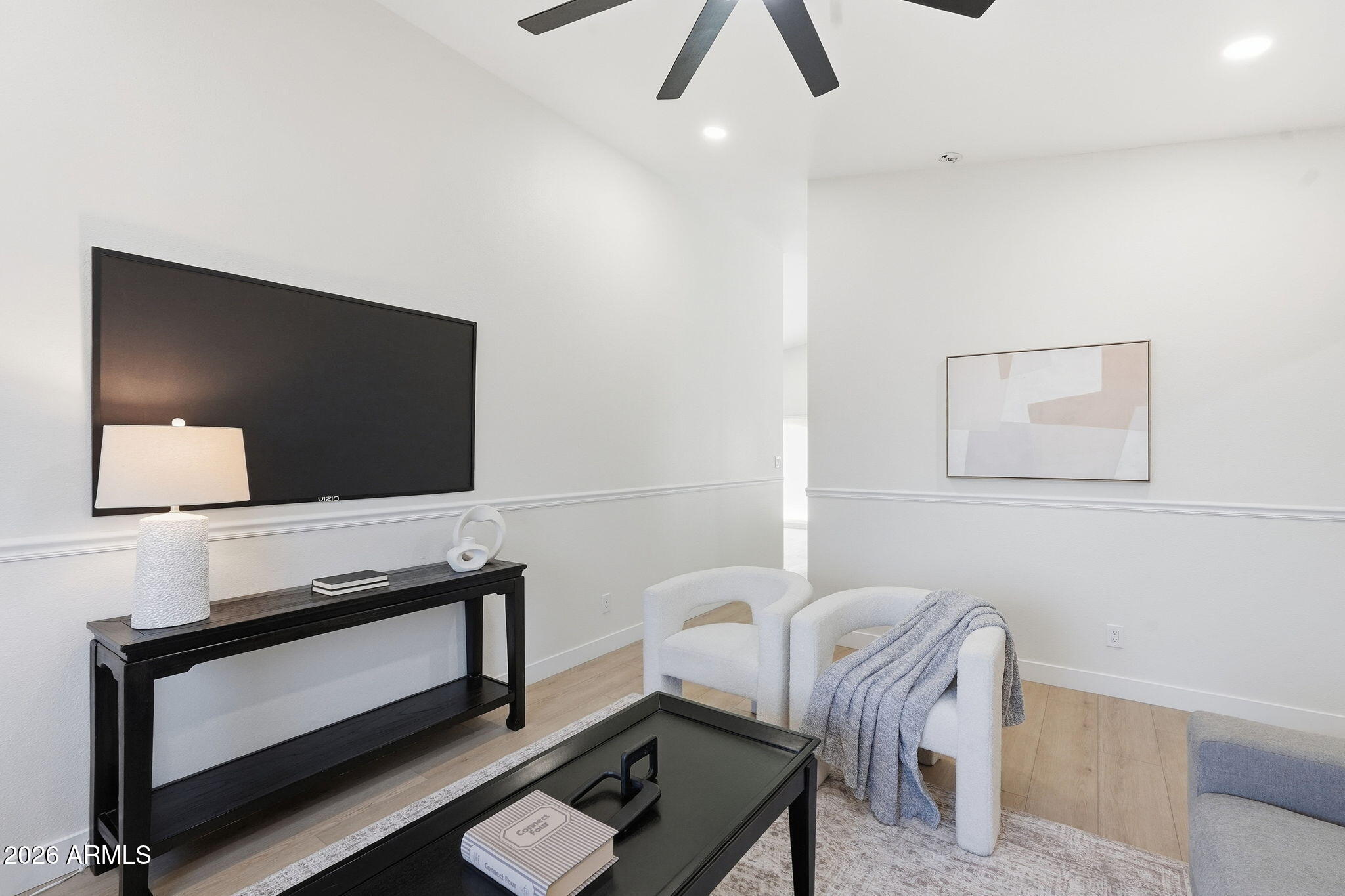 1663 West Monte Avenue Mesa, AZ 85202 - Photo 2 of 21 a living room with furniture and a flat screen tv