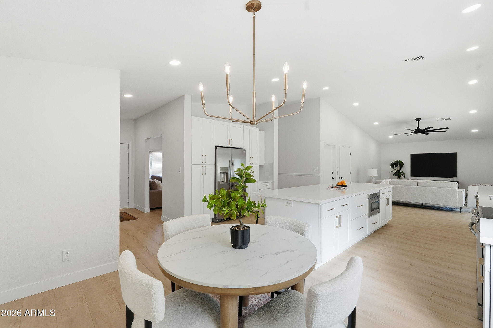 1663 West Monte Avenue Mesa, AZ 85202 - Photo 6 of 21 a kitchen with kitchen island a white counter top space and a sink