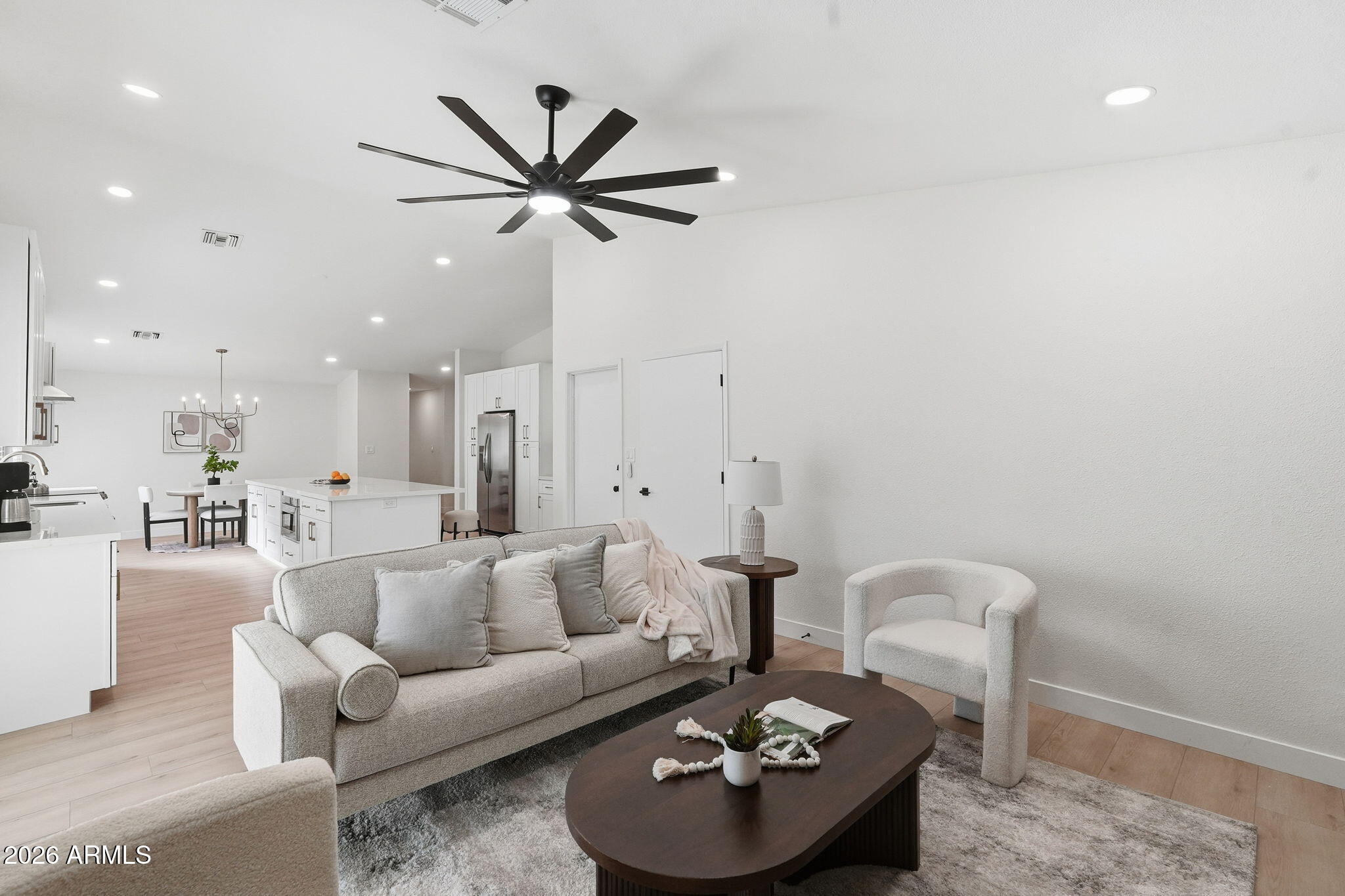 1663 West Monte Avenue Mesa, AZ 85202 - Photo 10 of 21 a living room with furniture and a wooden floor