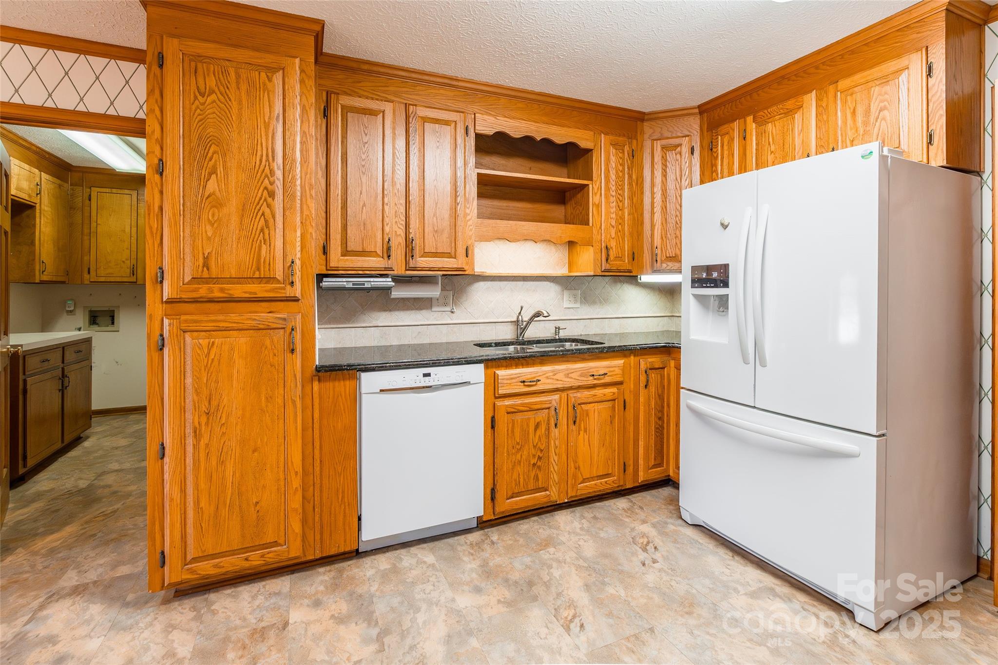 673 Tirzah Road York, SC 29745 - Photo 12 of 37 a kitchen with stainless steel appliances a refrigerator sink and cabinets