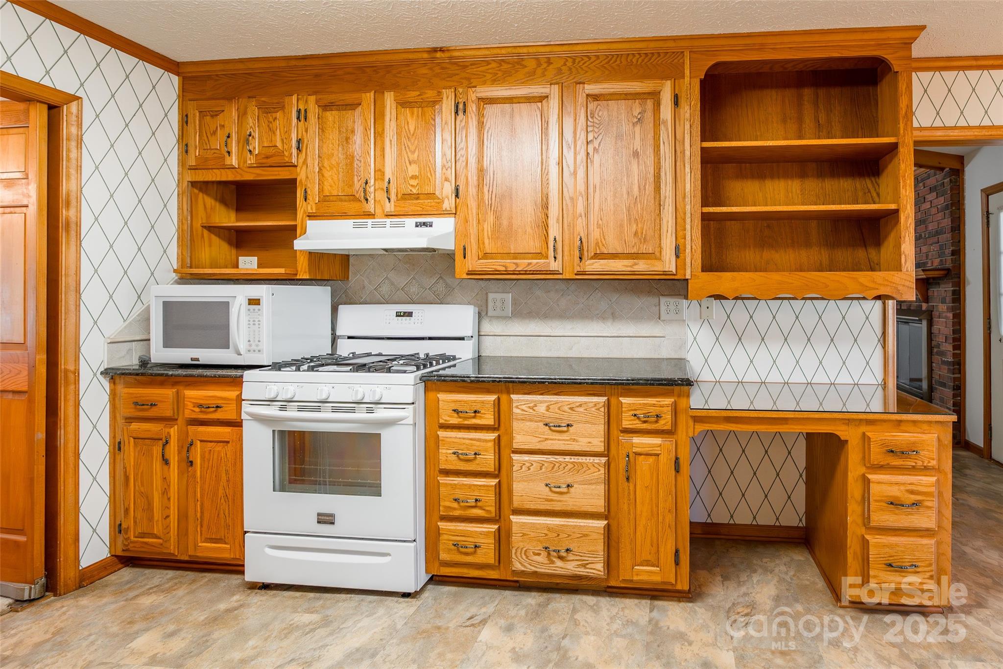 673 Tirzah Road York, SC 29745 - Photo 13 of 37 a kitchen with stainless steel appliances granite countertop a refrigerator and cabinets