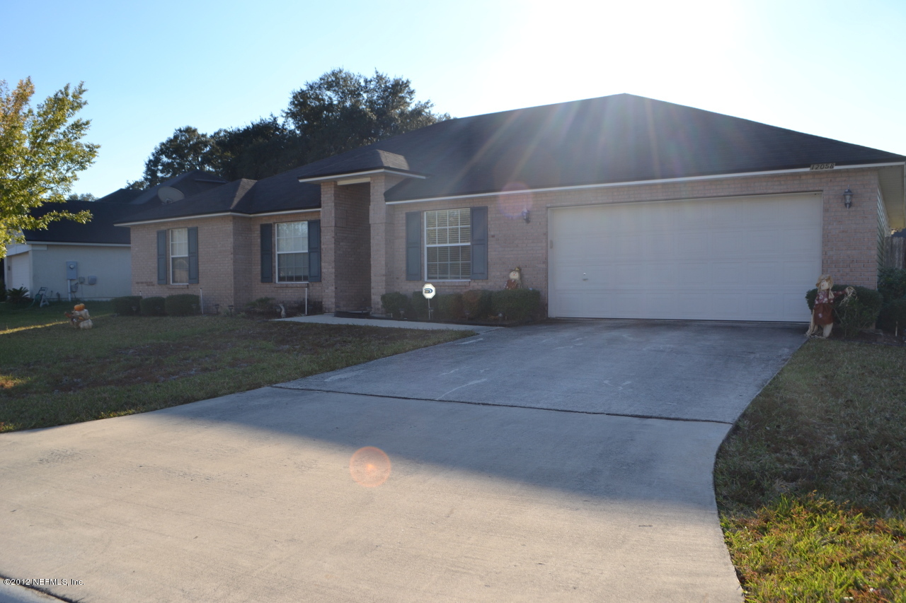 12058 Spring Ridge Drive Jacksonville, FL 32258 - Photo 1 of 9 a house view with a outdoor space