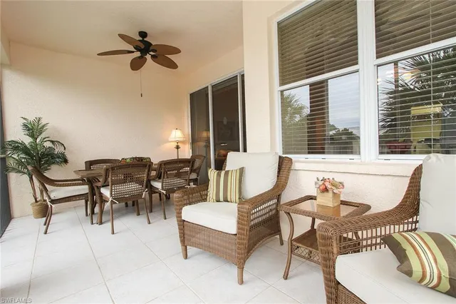 a view of a patio with a dining table and chairs