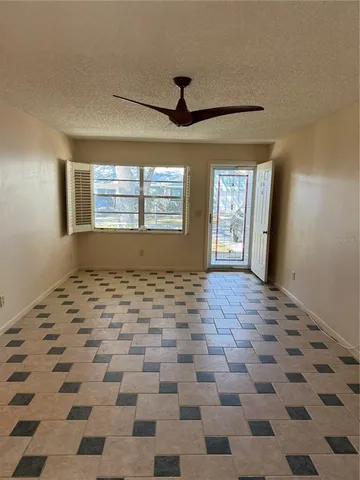 a view of a livingroom with a black and white checkered floor