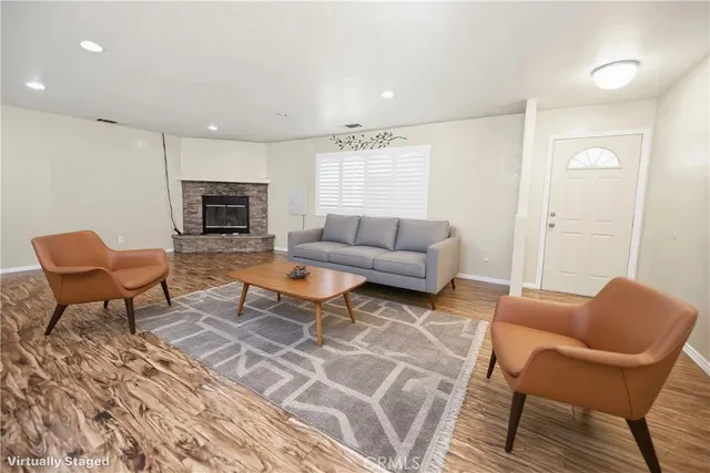 a living room with furniture and a fireplace