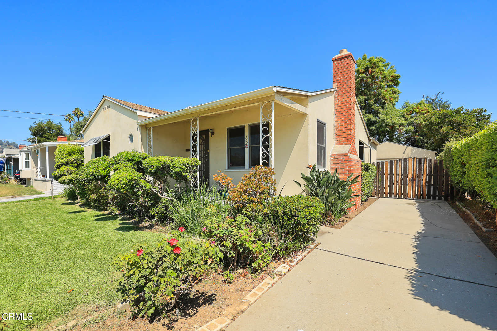 563 Toolen Place Pasadena, CA 91103 - Photo 3 of 12 a front view of a house with a yard