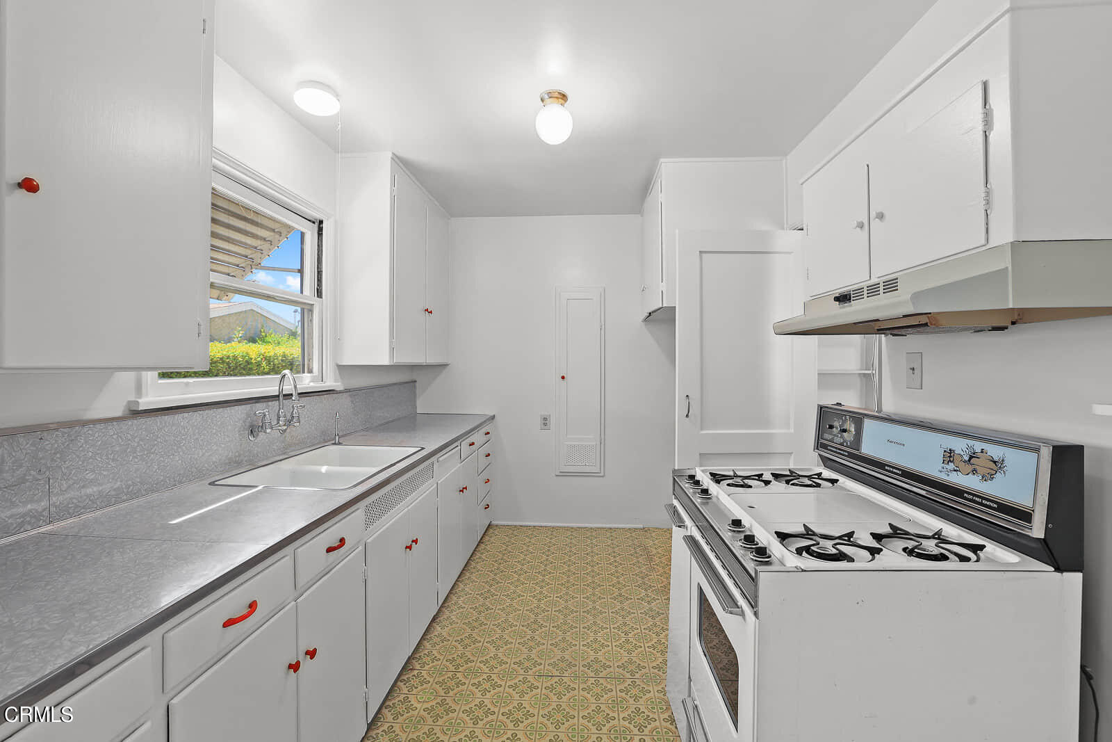 563 Toolen Place Pasadena, CA 91103 - Photo 6 of 12 a kitchen with a stove and a sink