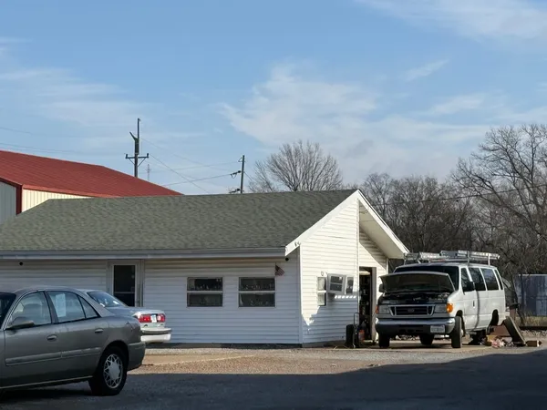 a front view of a house with parking space