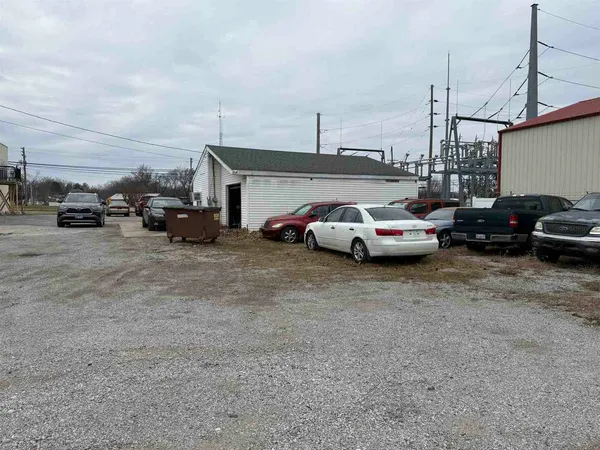 a car parked in parking lot of a building