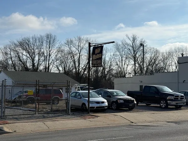 a view of a cars parked in front of a house