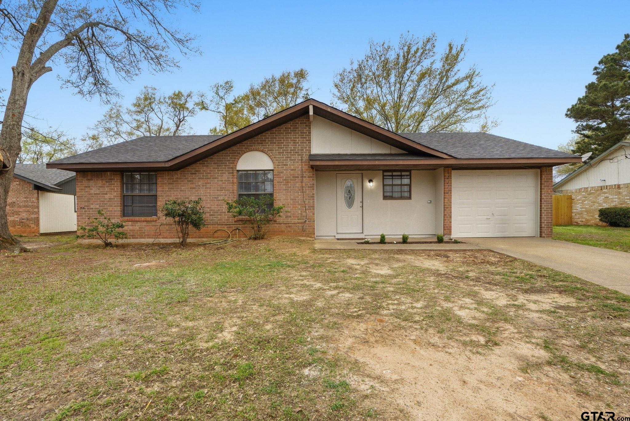 2716 Manilee Lane Tyler, TX 75702 - Photo 1 of 20 a view of a house with a yard