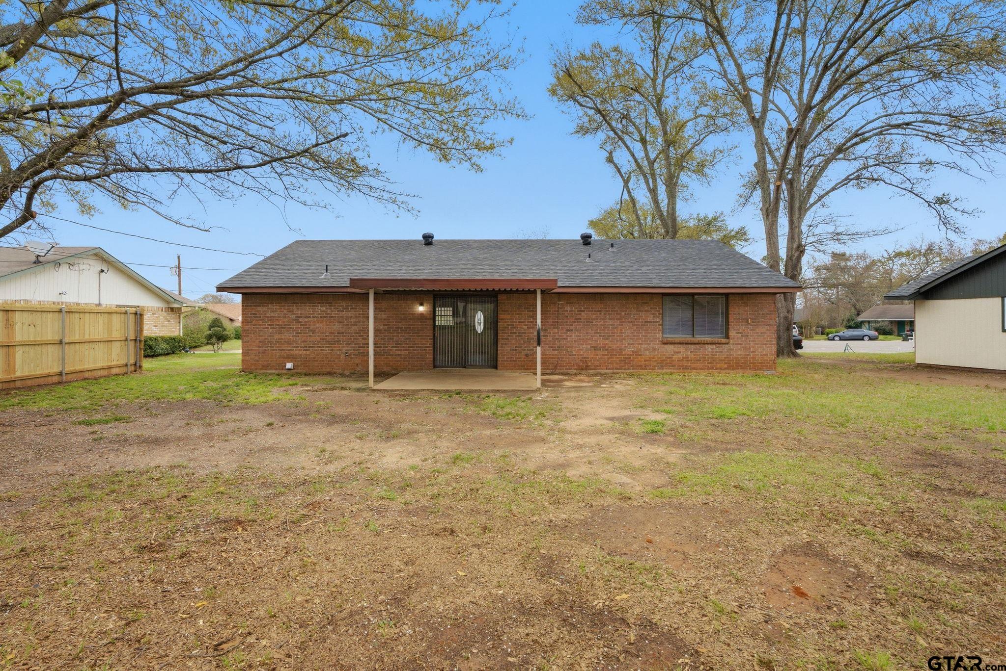 2716 Manilee Lane Tyler, TX 75702 - Photo 19 of 20 a front view of a house with a garden