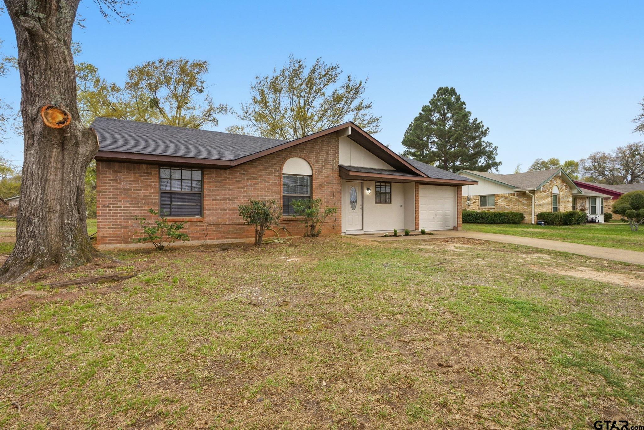 2716 Manilee Lane Tyler, TX 75702 - Photo 2 of 20 a front view of a house with a yard