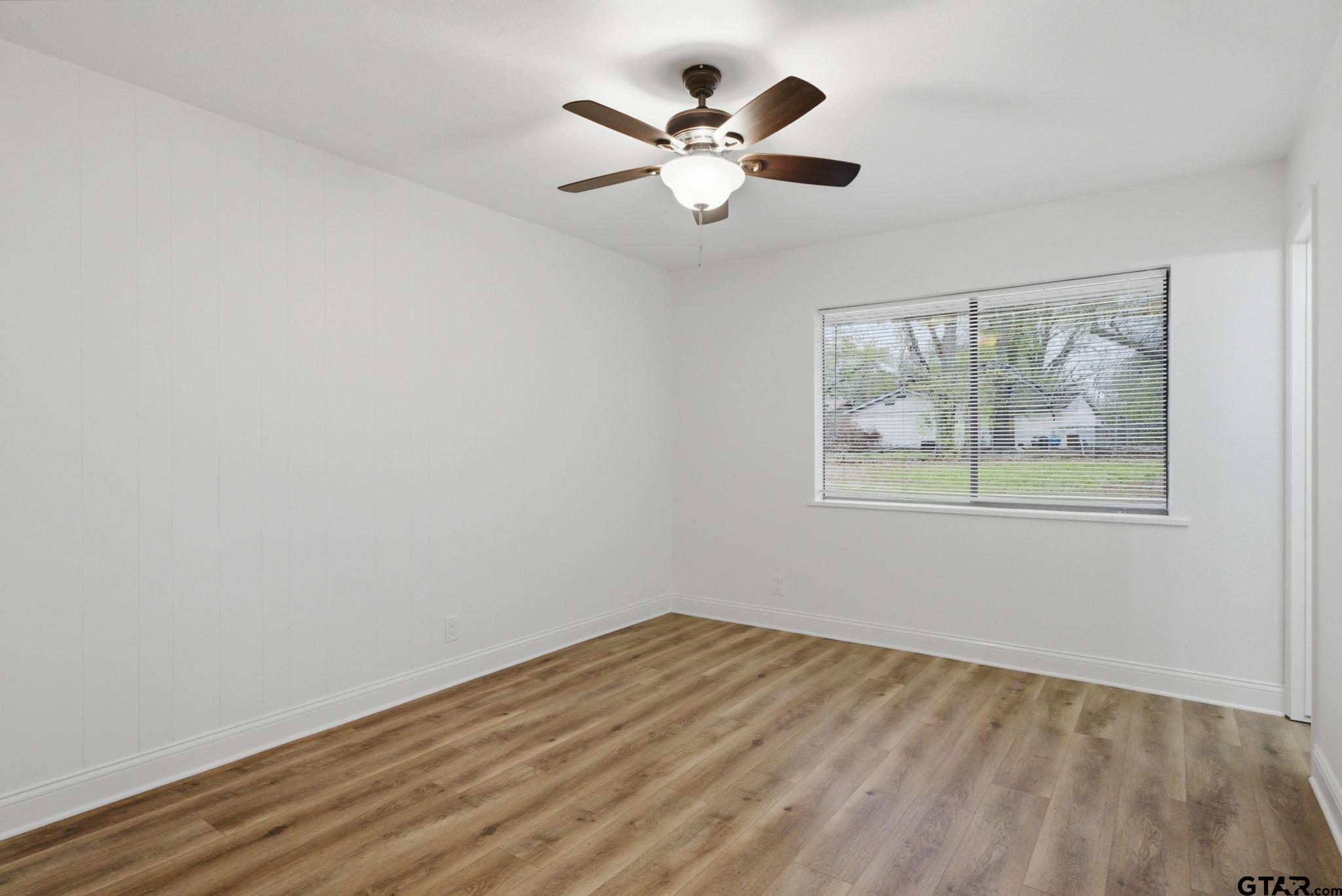2716 Manilee Lane Tyler, TX 75702 - Photo 9 of 20 a view of empty room with wooden floor