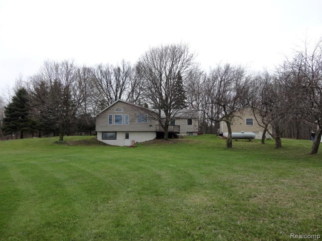 4650 General Squier Road Dryden, MI 48428 - Photo 32 of 38 Rear of Home showing Walk-Out Basement