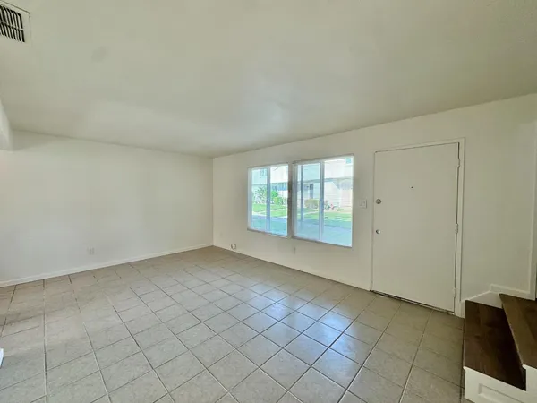 a kitchen with stainless steel appliances granite countertop white refrigerator stove a sink and dishwasher