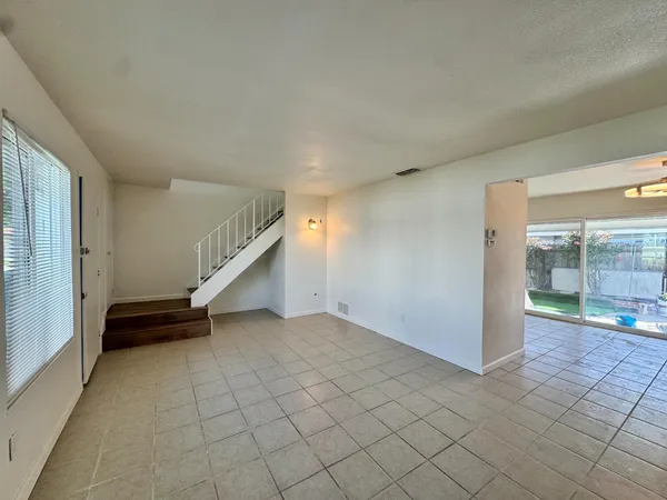 a kitchen with cabinets appliances and a sink