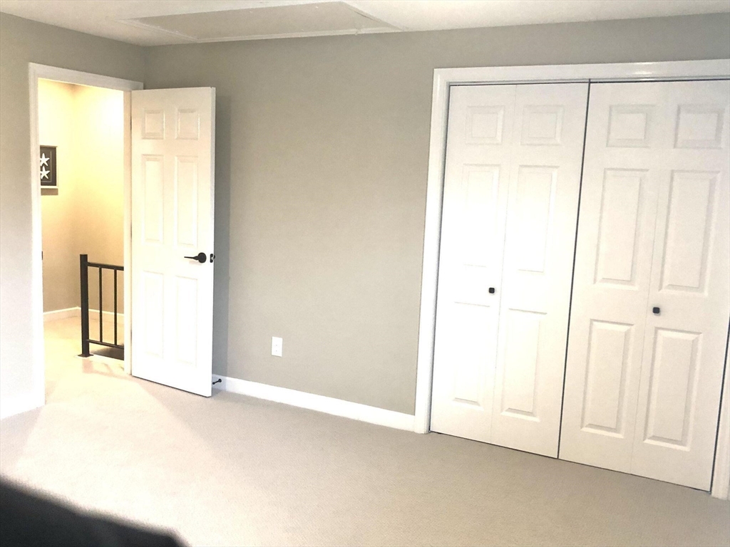 135 West Main Street, Unit 26 Barnstable, MA 02601 - Photo 10 of 11 an empty room with window