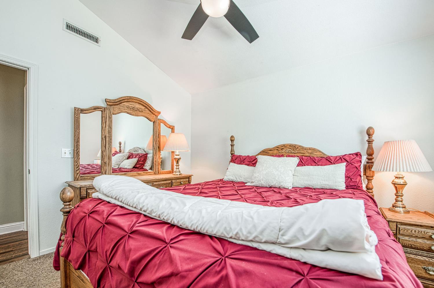 980 North Adler Avenue Clovis, CA 93611 - Photo 22 of 42 a bedroom with a bed and a mirror