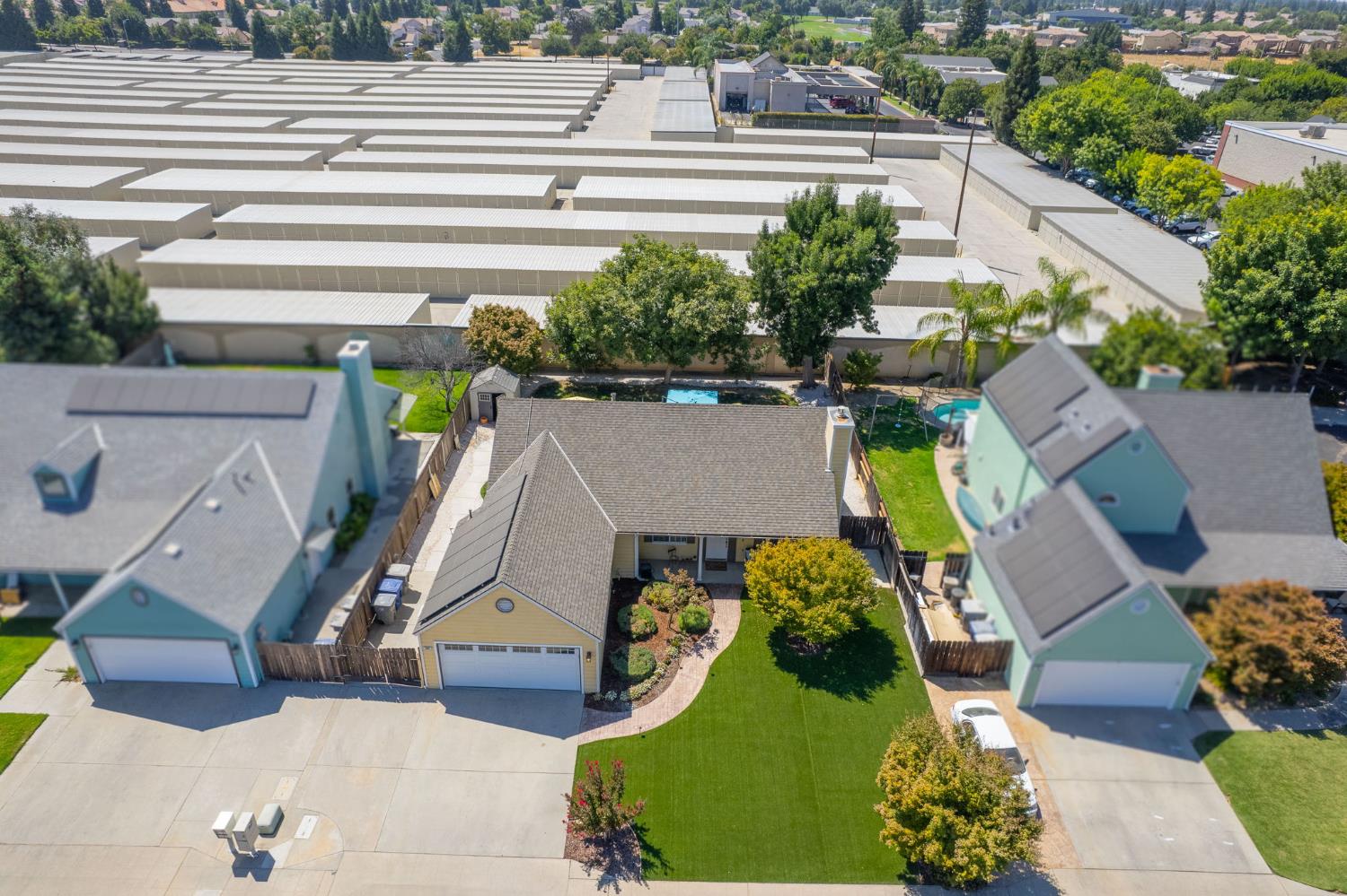 980 North Adler Avenue Clovis, CA 93611 - Photo 39 of 42 an aerial view of a house with a swimming pool and outdoor space
