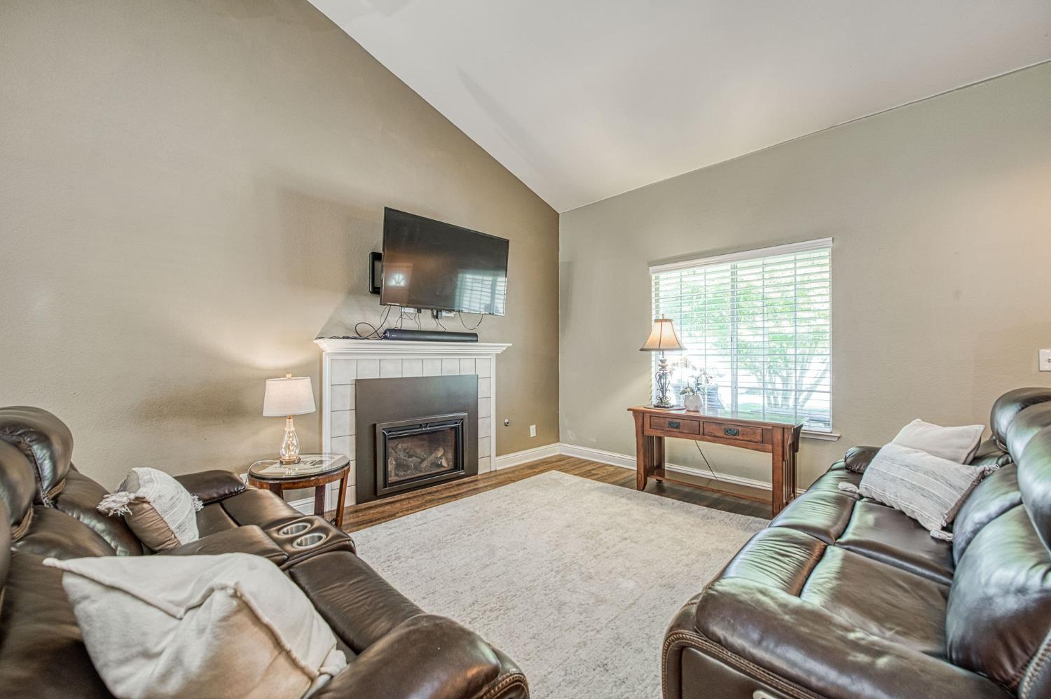 980 North Adler Avenue Clovis, CA 93611 - Photo 7 of 42 a living room with furniture and a fireplace