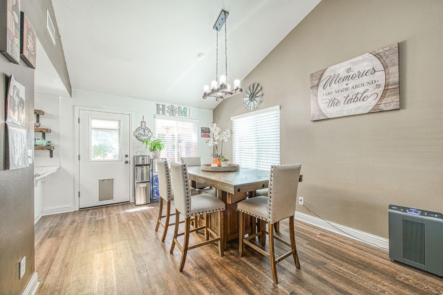 980 North Adler Avenue Clovis, CA 93611 - Photo 10 of 42 a view of a dining room with furniture window and wooden floor