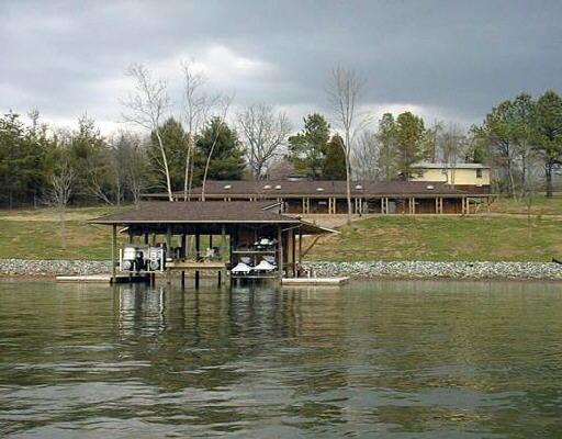 a view of a lake with houses in the back