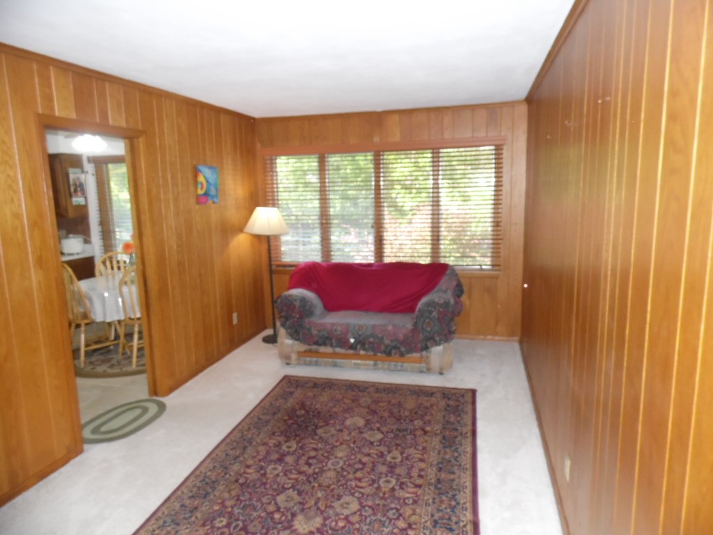 3305 Spring Creek Road Rockford, IL 61107 - Photo 11 of 20 a living room with furniture and a fireplace