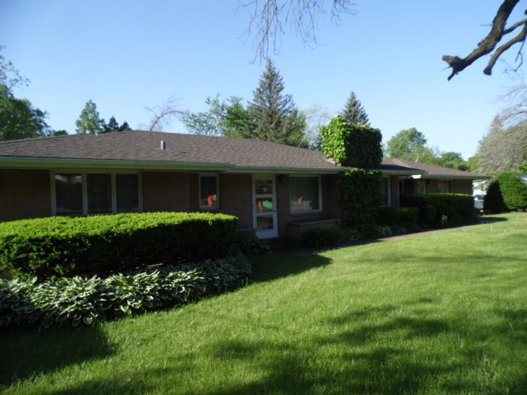 3305 Spring Creek Road Rockford, IL 61107 - Photo 20 of 20 a front view of a house with a garden