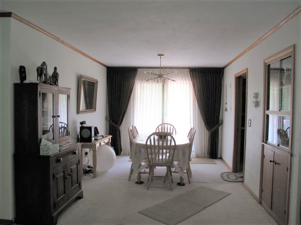 3305 Spring Creek Road Rockford, IL 61107 - Photo 4 of 20 a living room with furniture and a large window