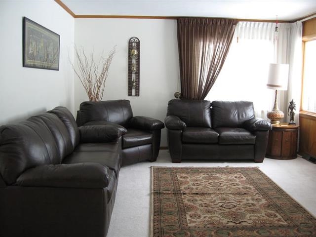 3305 Spring Creek Road Rockford, IL 61107 - Photo 6 of 20 a living room with furniture and a window