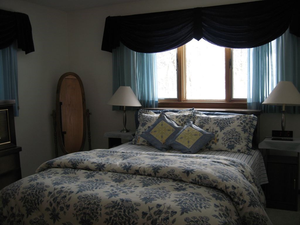 3305 Spring Creek Road Rockford, IL 61107 - Photo 7 of 20 a bed sitting in a bedroom next to a window